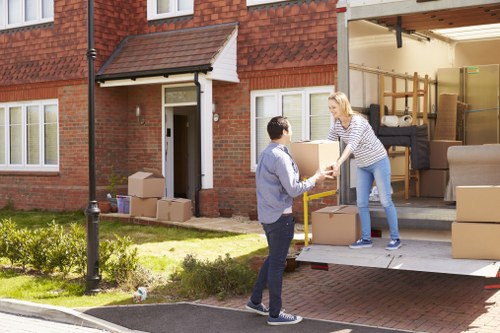Local moving team unpacking household items in a Streatham property
