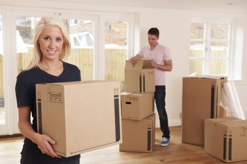 Flat removals team handling apartment furniture in Streatham
